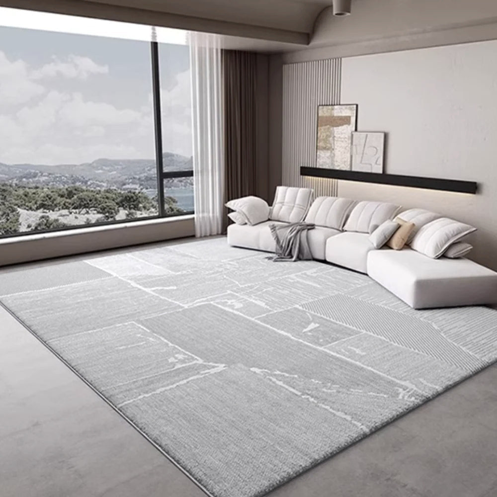 Large grey textured rug in a modern living room with scenic view