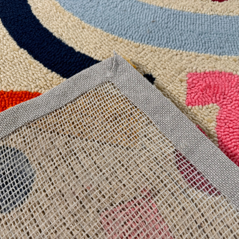 Close-up of Desert Sand multicolor rug edge with soft texture and intricate patterns