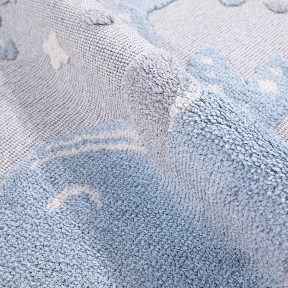 Gentle Tides Whale Rug featuring soft textures in calming pastel blue.