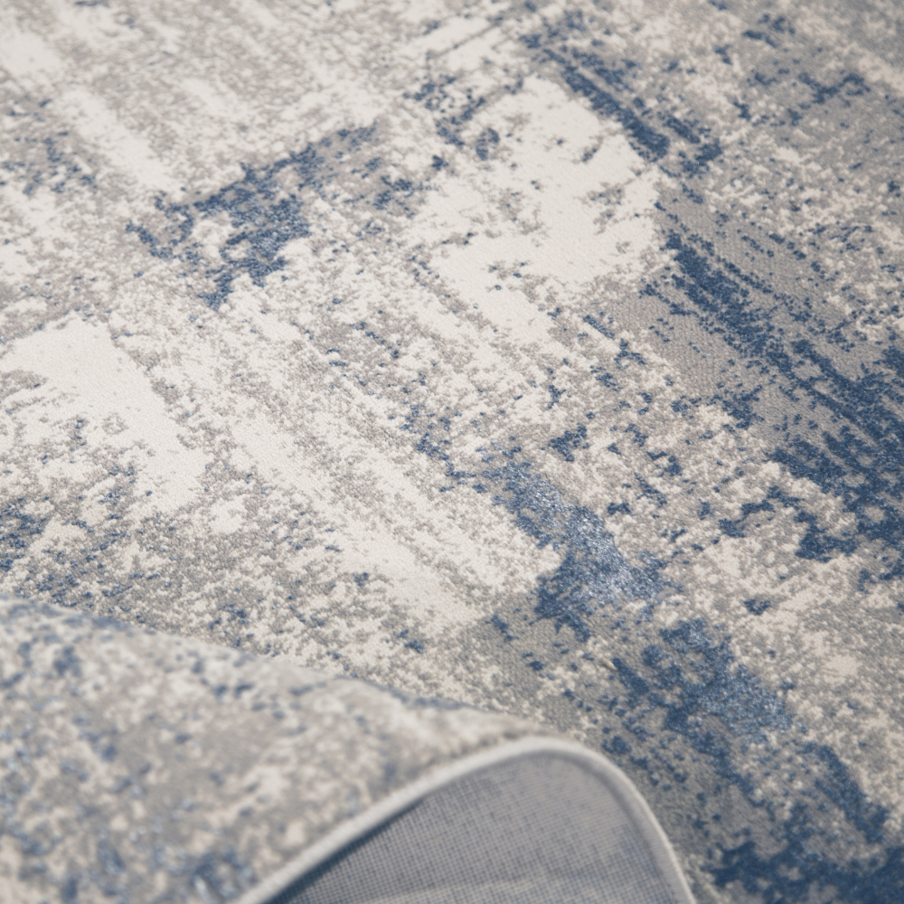 Blue and gray abstract rug, perfect for enhancing contemporary home interiors.
