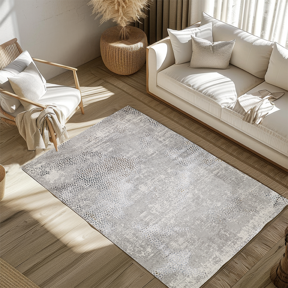 Stylish gray textured rug with honeycomb design in modern living room setting.