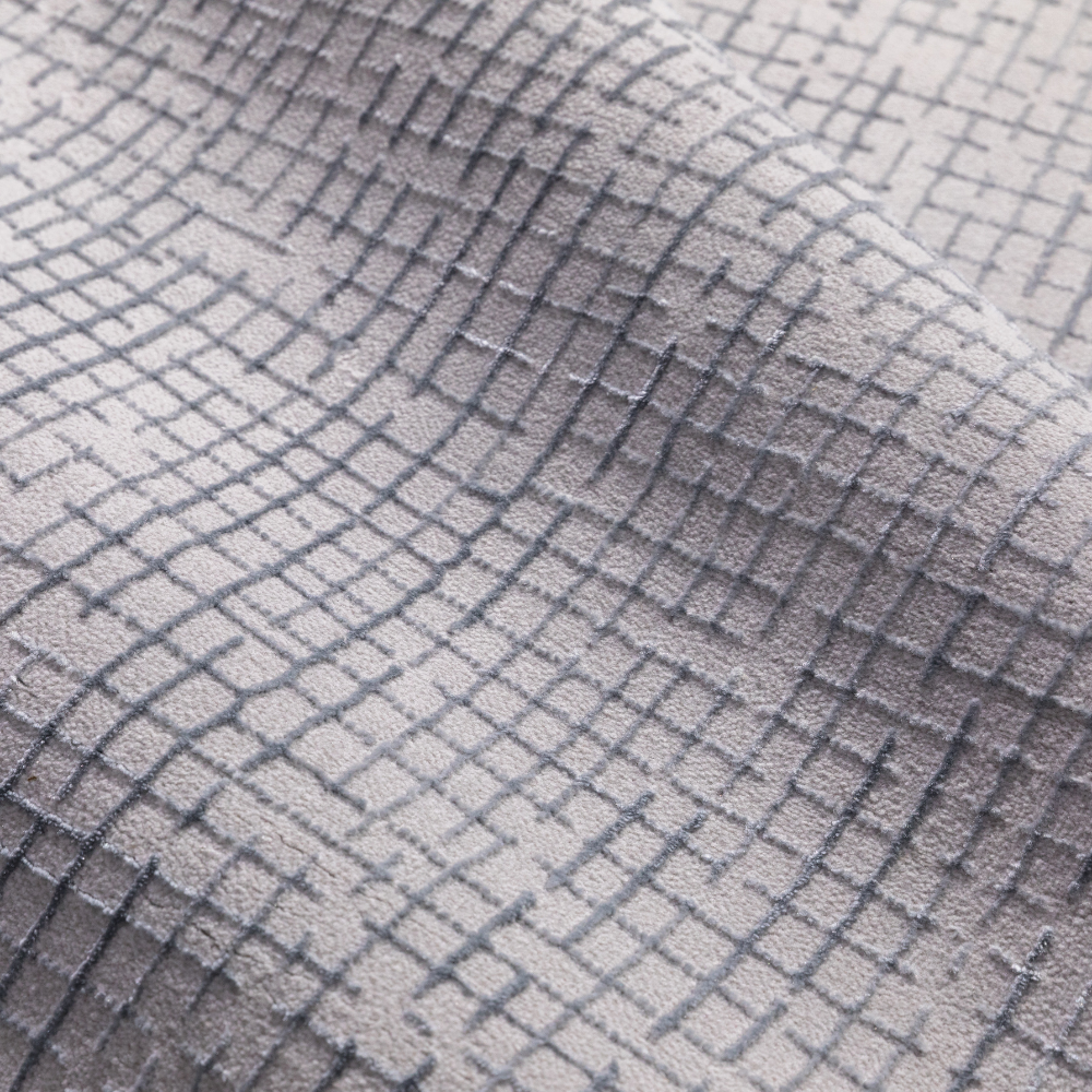 Textured Zuri Checkered Rug in light gray tones for stylish home decor.