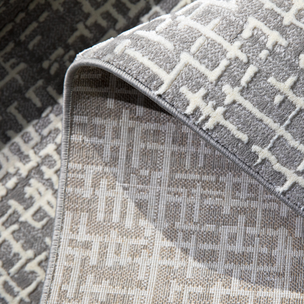 Textured grey Odin rug with checkered design for stylish home interiors