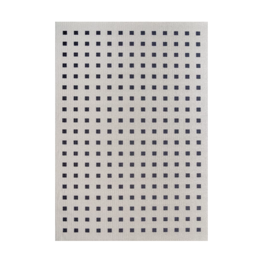 Modern textured rug with navy squares on light background