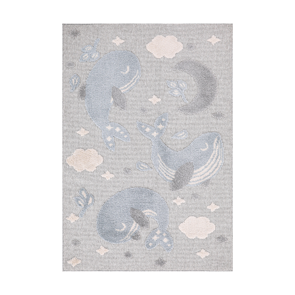 Gentle Tides Whale Woven Rug with pastel whales and clouds